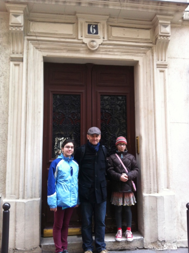 Scott and the girls in front of the apartment building where we stayed in Montmartre. 
